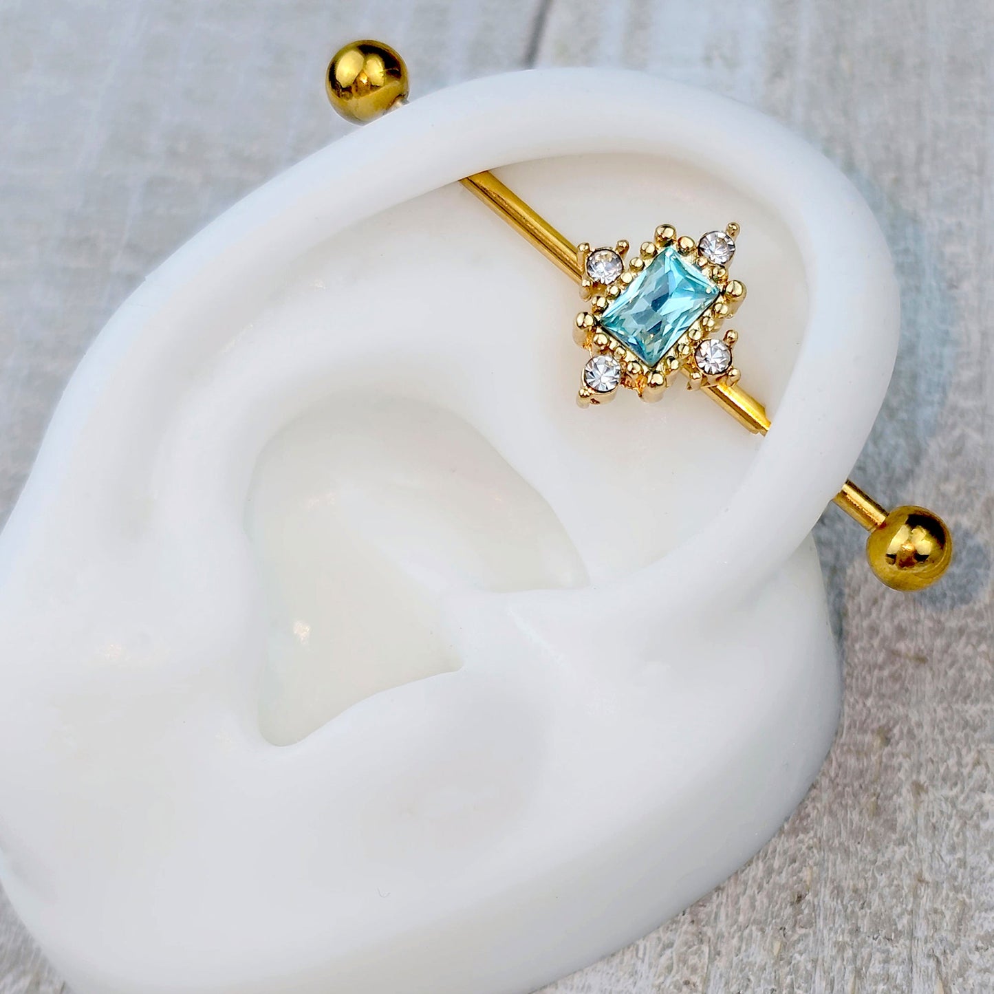 14G Blue Clear Gem Gold Tone Regal Seal Industrial Barbell 38mm